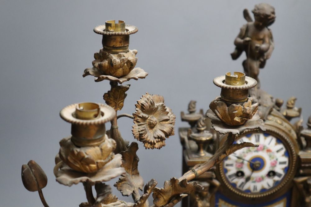 A 19th century French ormolu and Sèvres style porcelain matched garniture de cheminée